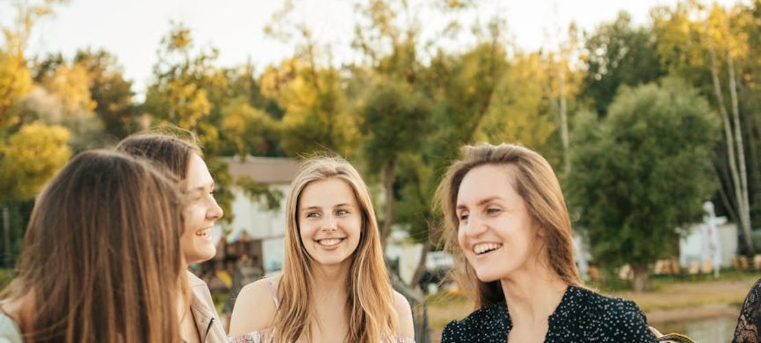 A diverse group of people interacting positively in a community setting.